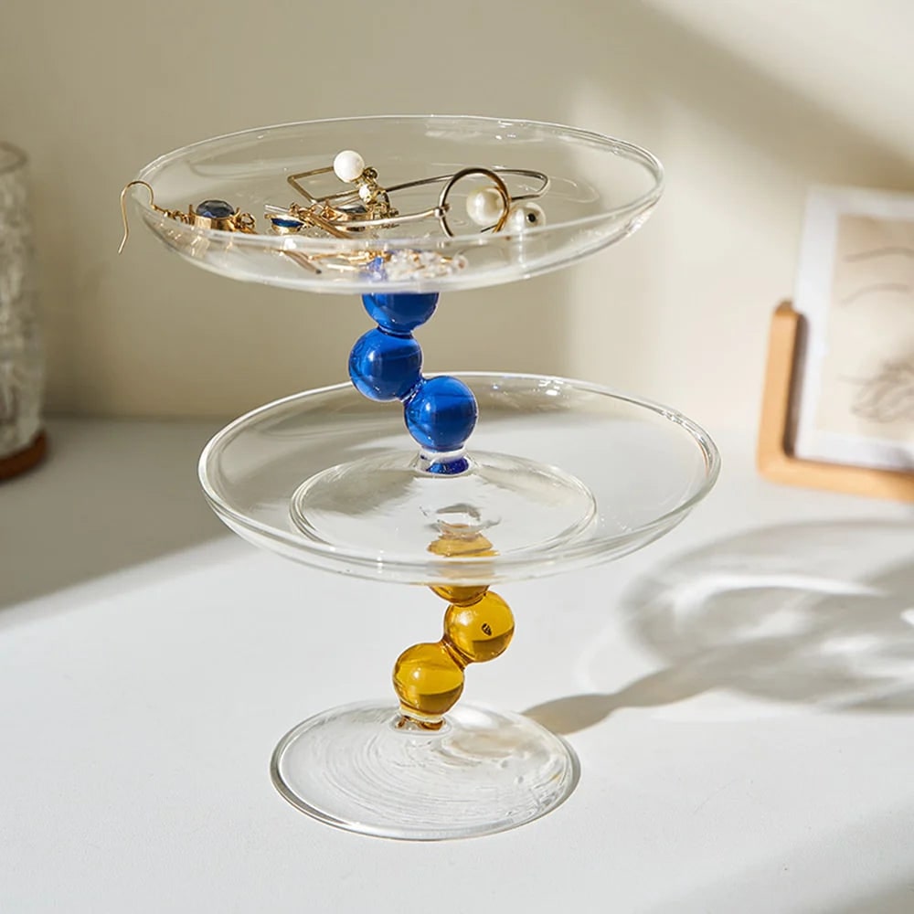 Curved glass jewelry tray with a minimalist design, perfect for rings and accessories