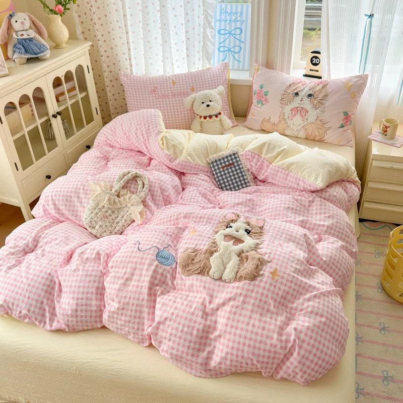 Cute pink plaid cat bedding with ruffle edges and soft washed cotton fabric.