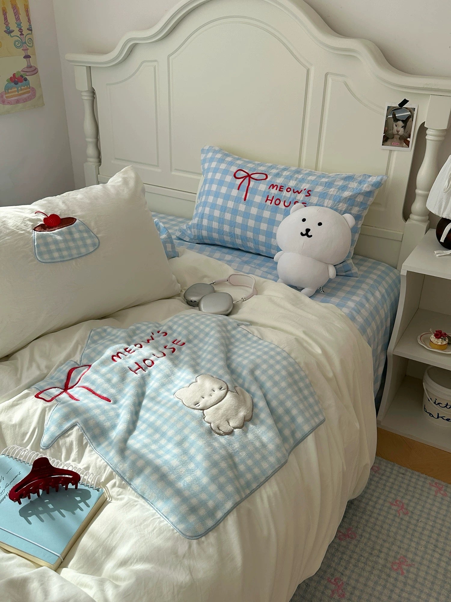 Kawaii cat bedding with blue gingham pillow and cozy cotton quilt.