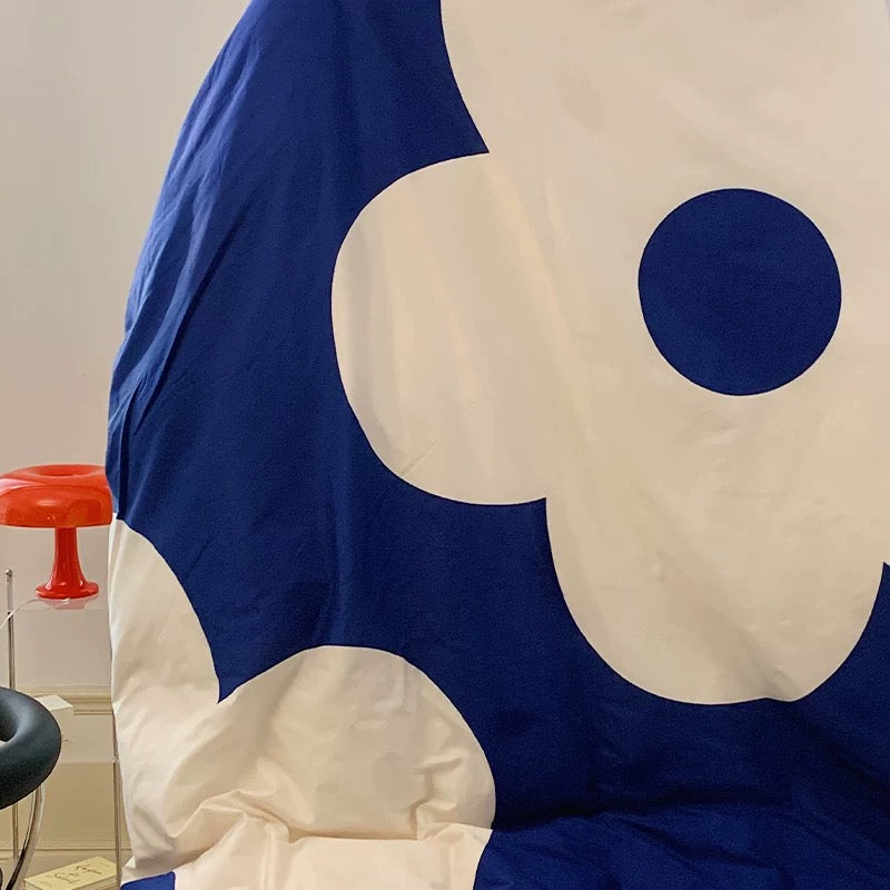 Twin bed setup with bold cotton floral duvet