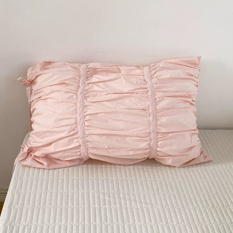 Elegant white cotton pleated pillowcase, soft and durable for everyday use.