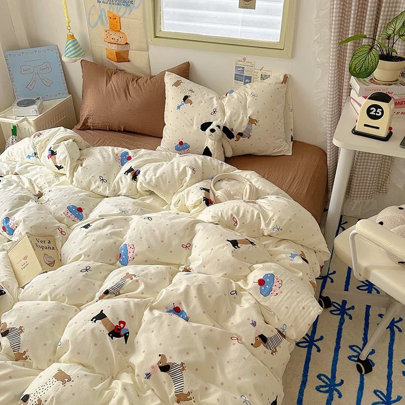 Bed with cartoon-patterned bedding in a cozy bedroom setting