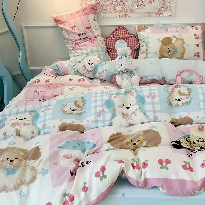 Close-up of pastel plaid pattern with cute puppy illustrations on the duvet cover.