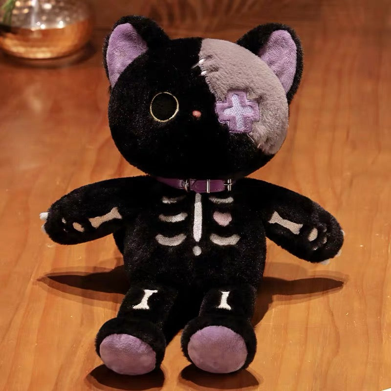 Black plush toy with skeleton design on a wooden surface