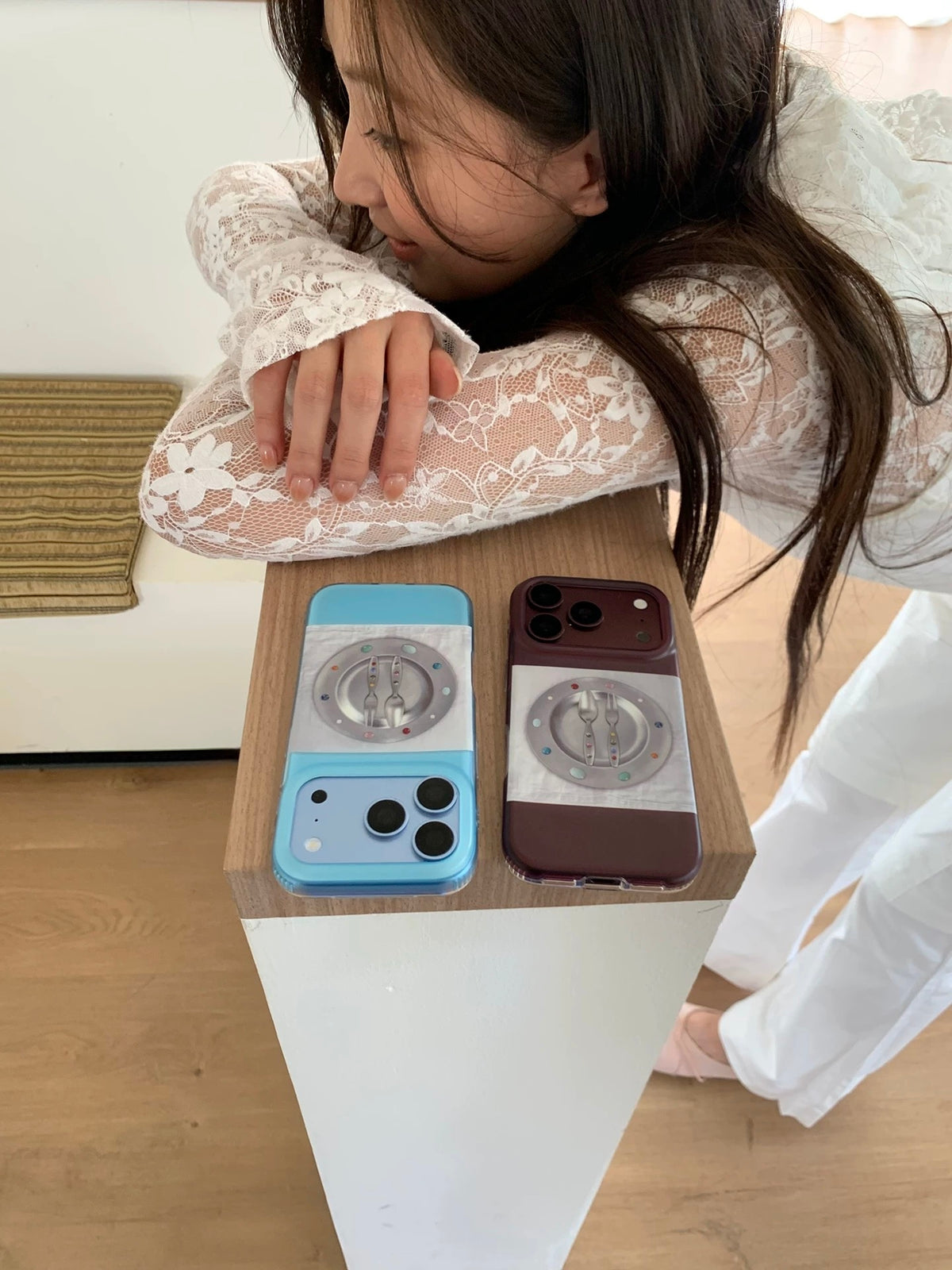 Two cute Korean phone case colors, Glacier Blue and Burgundy, displayed together with plate and cutlery artwork.