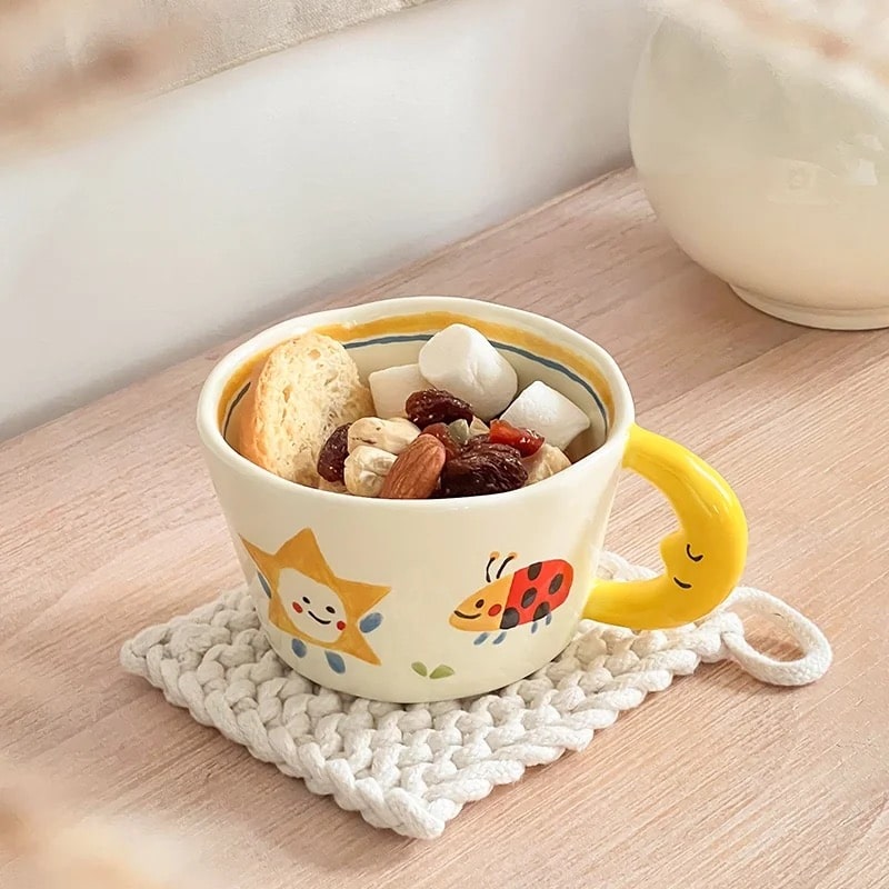 Yellow ceramic mug with hand-painted ladybug design. Korean style coffee cup with moon handle, perfect for kids and couples.