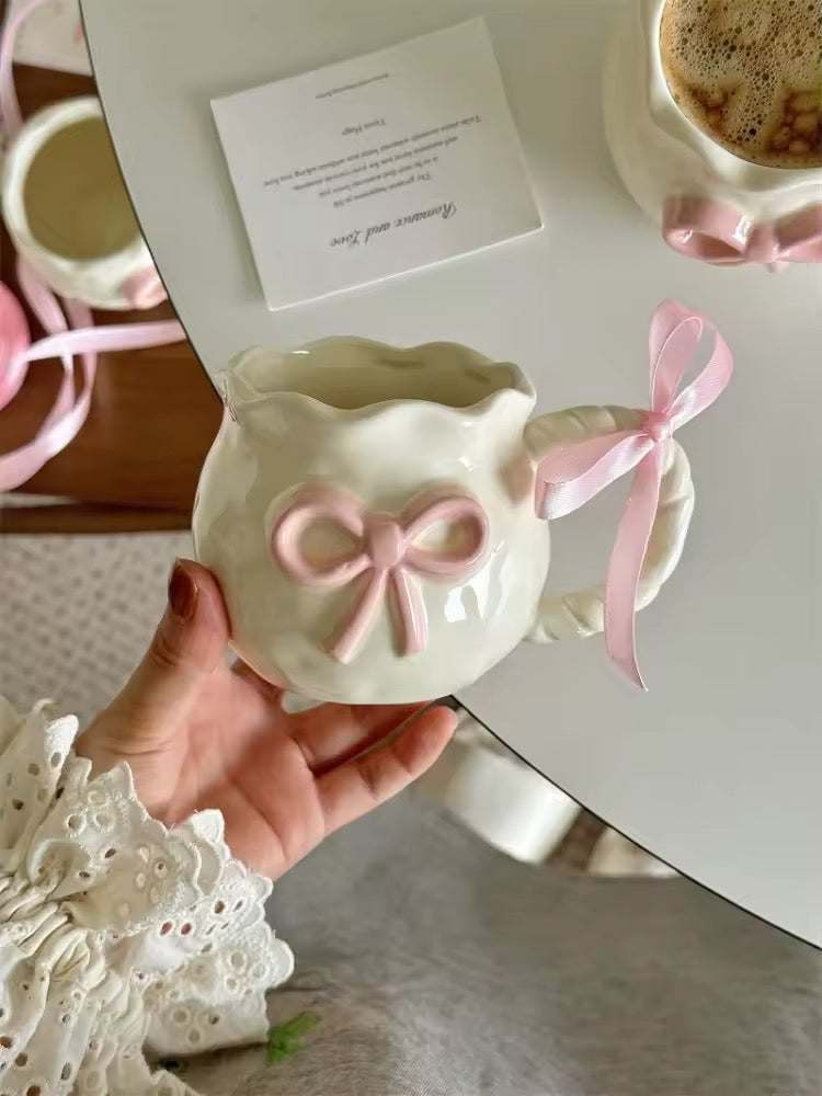 Pink ceramic bow mug styled on breakfast tray