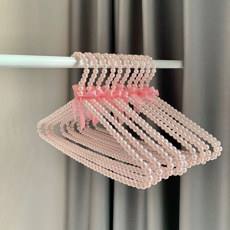 Fashion display hanger with pearls and bow