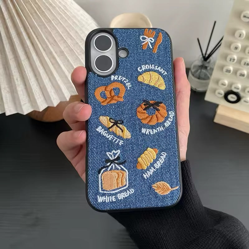 Denim iPhone case with embroidered croissant and pretzel