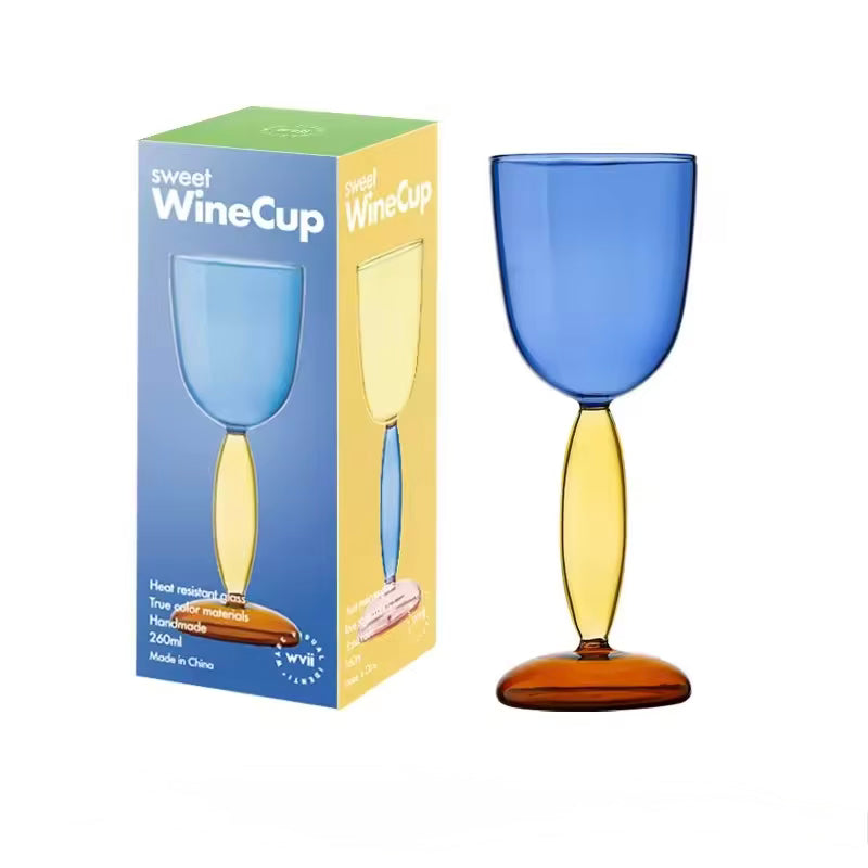 Blue and yellow wine cup with packaging on a white background