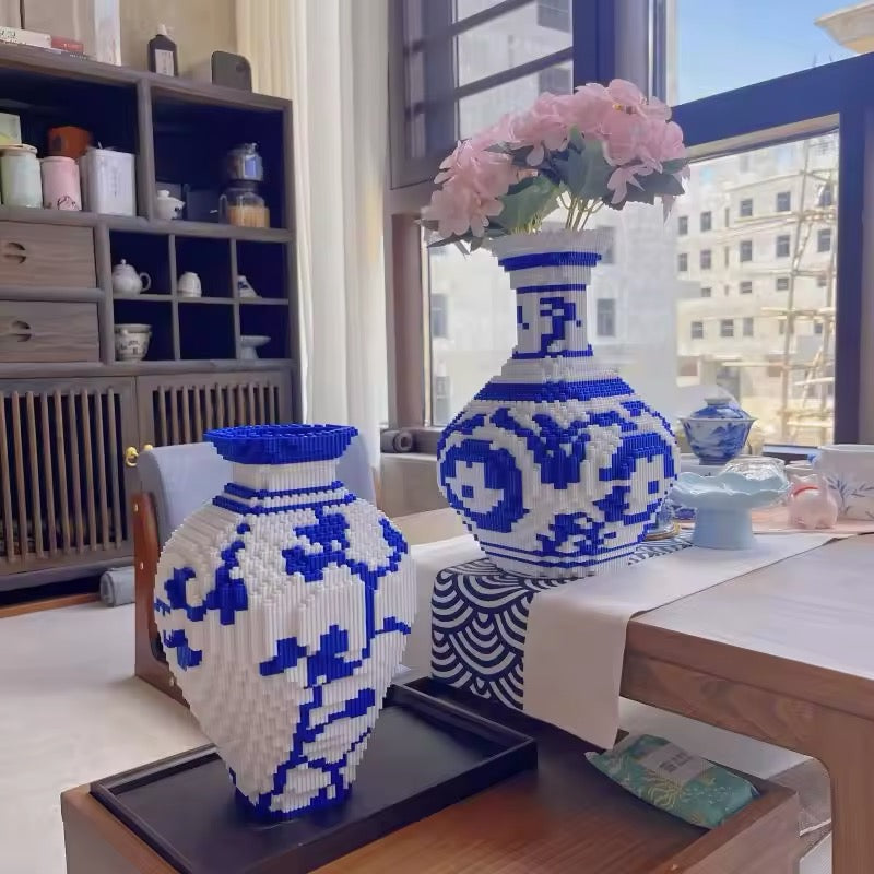 Close-up of assembled blue and white porcelain-style vase built from blocks, showcasing intricate Chinese patterns.
