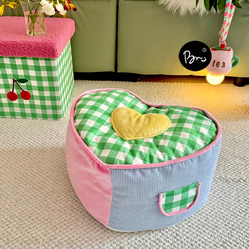 Pastel coquette pouf cushion styled with Canadian dorm essentials