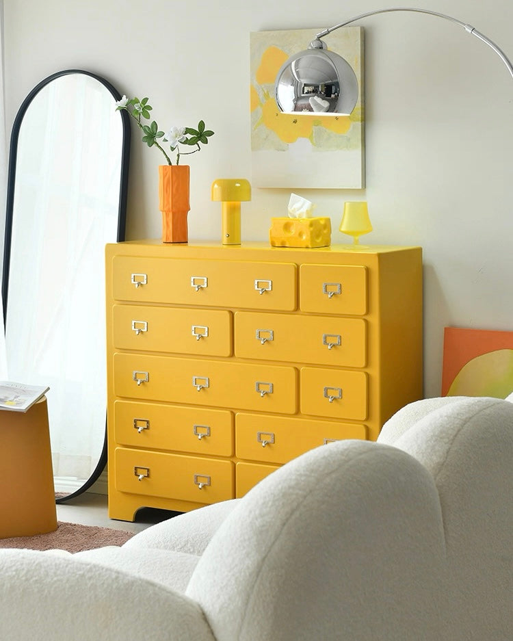 Pink dopamine drawer cabinet used as sideboard storage in pastel aesthetic interior