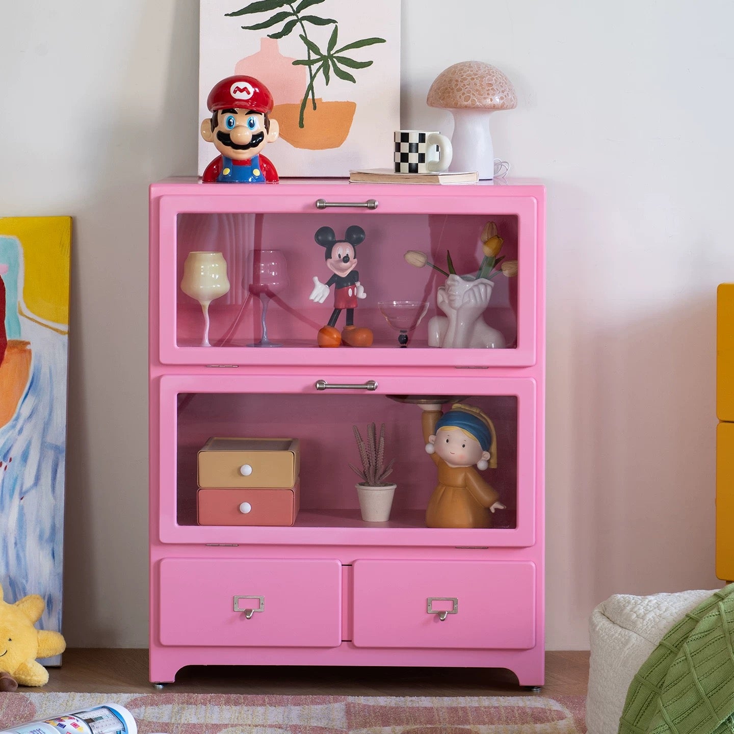 Pink dopamine display cabinet used as playful storage sideboard in pastel aesthetic interior room design