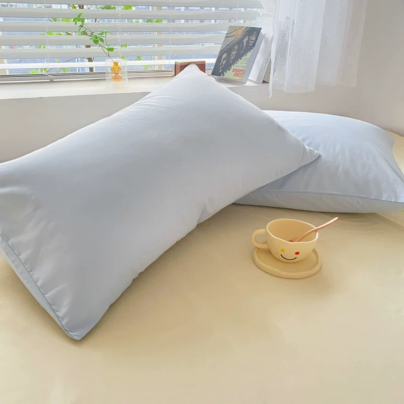 Cozy cream and blue bedding set with soft polyester fabric for small apartments.