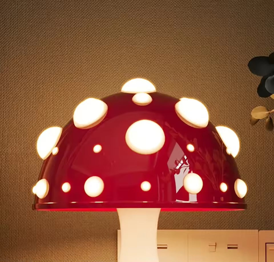 Mushroom-shaped lamp with red cap and white spots on a brown wall background