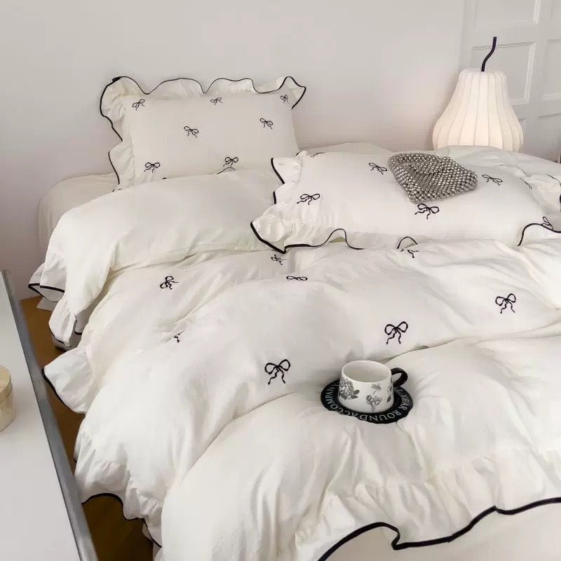 Close-up of bow detail on white duvet cover for aesthetic lovers
