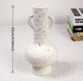 White ceramic vase for dried flower arrangements