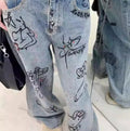 Hello Kitty high-waist jeans with wide-leg cut