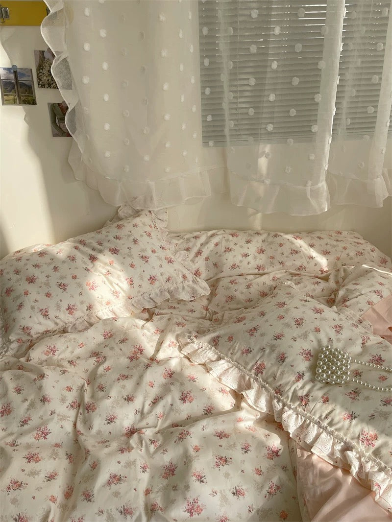 Delicate cotton floral duvet on bed skirted for feminine shabby chic look