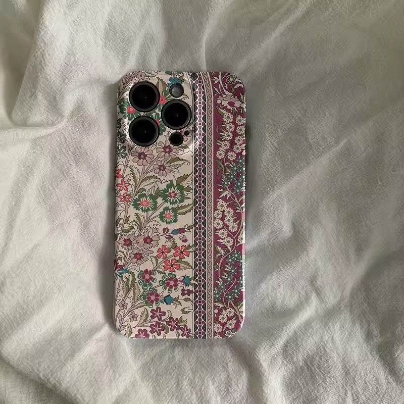 Close-up of the ethnic floral iPhone case showcasing intricate patterns and vibrant colors.