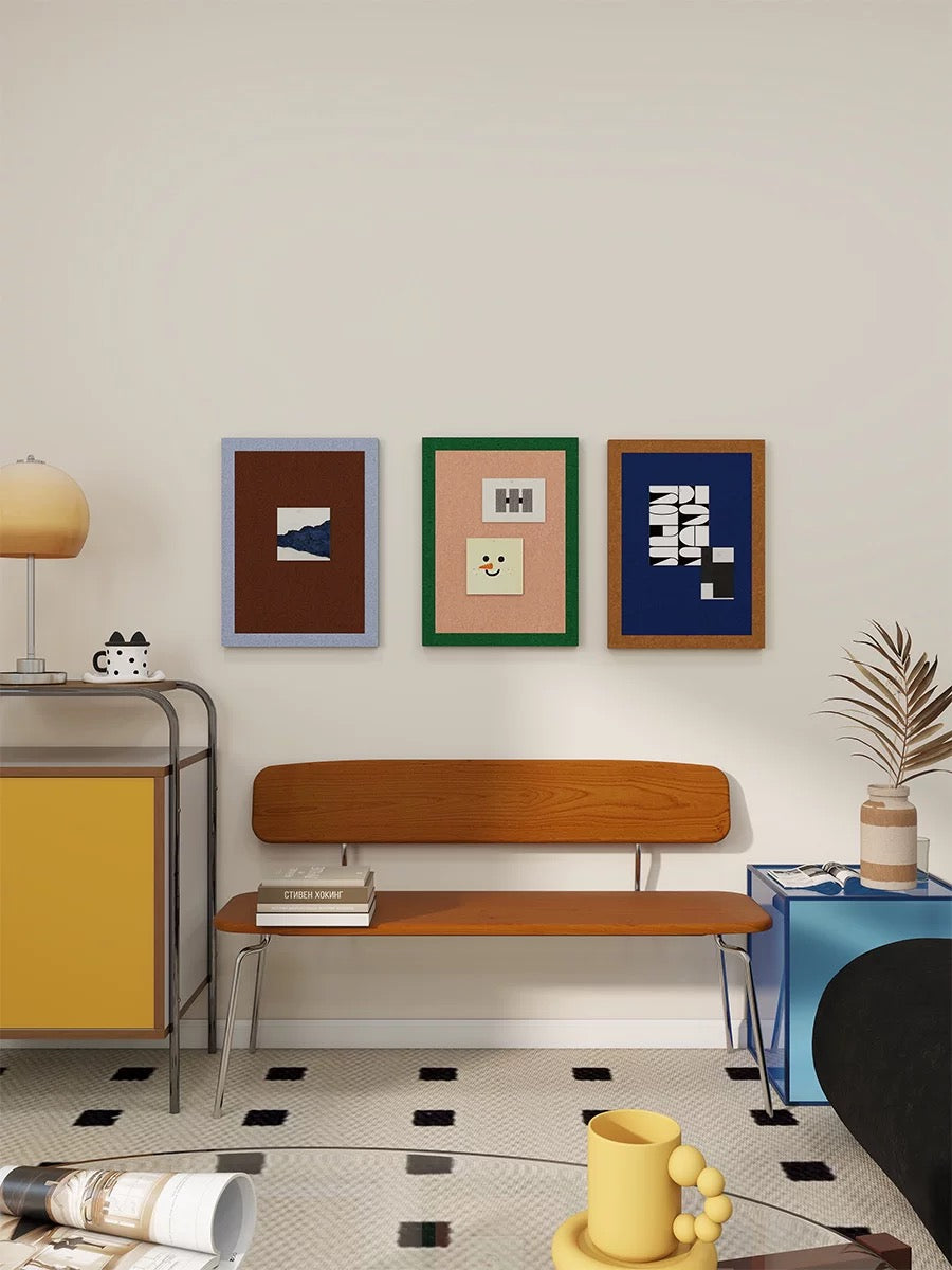 Colorful felt bulletin boards styled above a bench for photos and notes.