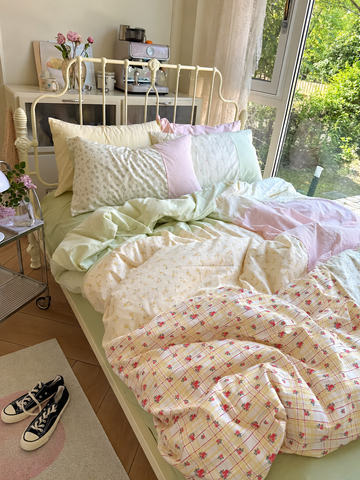Floral patchwork duvet cover with pastel pink green and cream panels