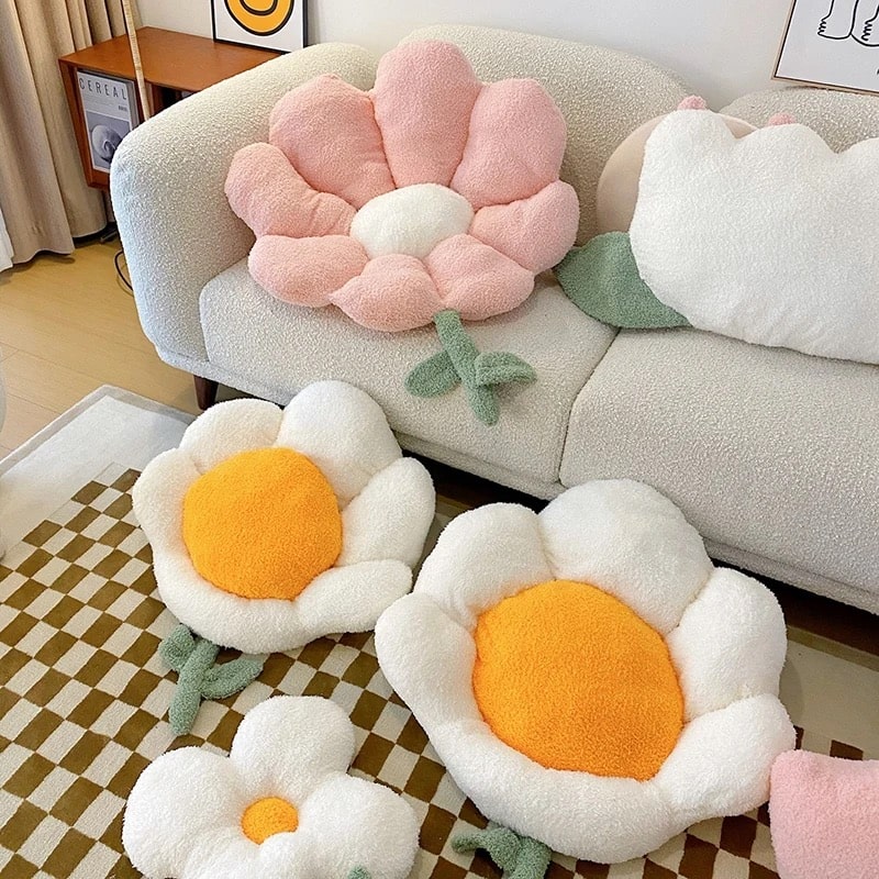 Vibrant daisy-shaped plush pillow for cozy lounge or nursery decor