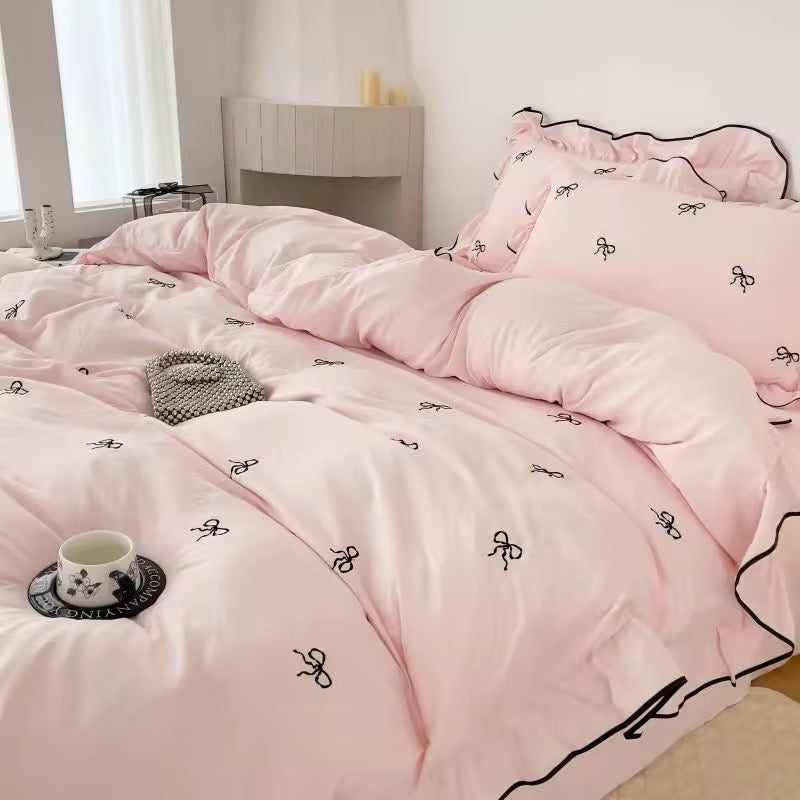 Embroidered bow pillowcases matching the princess bedding vibe