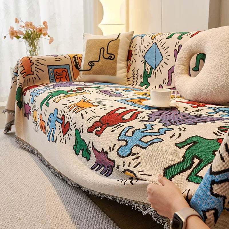 A dorm bed styled with the retro tapestry throw and pastel decor