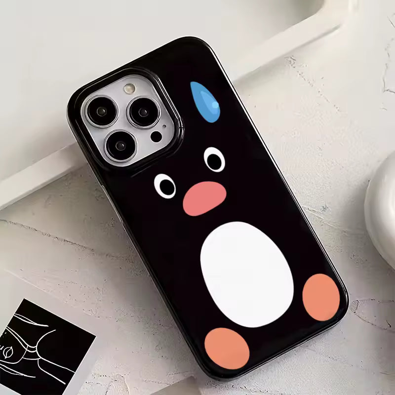 Phone case with cartoon face design on a light gray surface