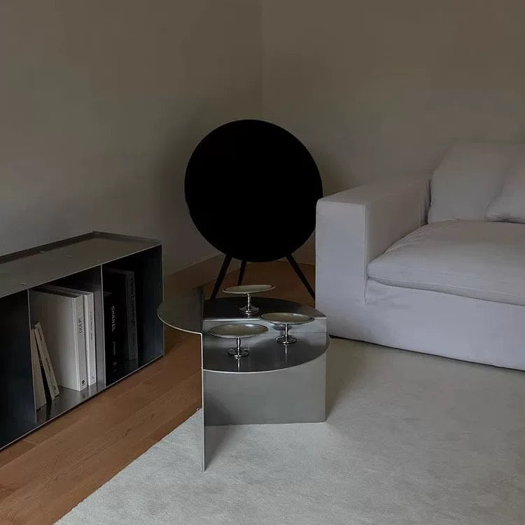 Modern Bauhaus coffee table adding minimalist geometric character to stylish living room with neutral furniture arrangement today.