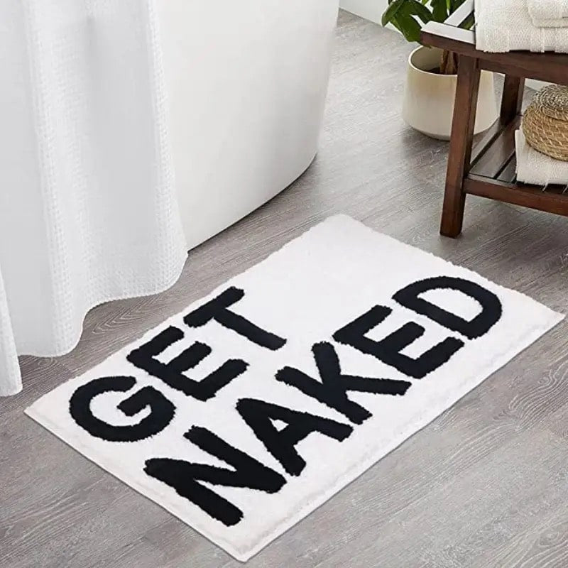 Black Get Naked bath mat with non-slip backing for modern decor