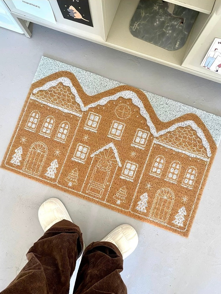Cinnamon gingerbread house Christmas door mat viewed from above