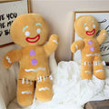 Soft gingerbread man plush toy for holiday decor.