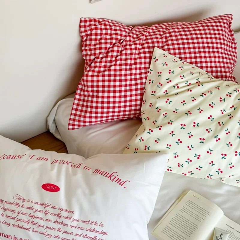 TikTok aesthetic setup with cherry pillowcase styled with neon heart lights.