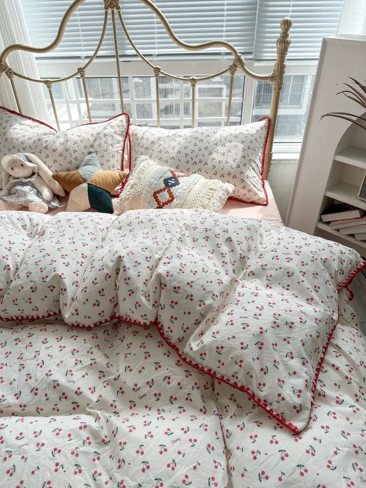 Cherry-themed Coquette bedding set displayed in a modern bedroom