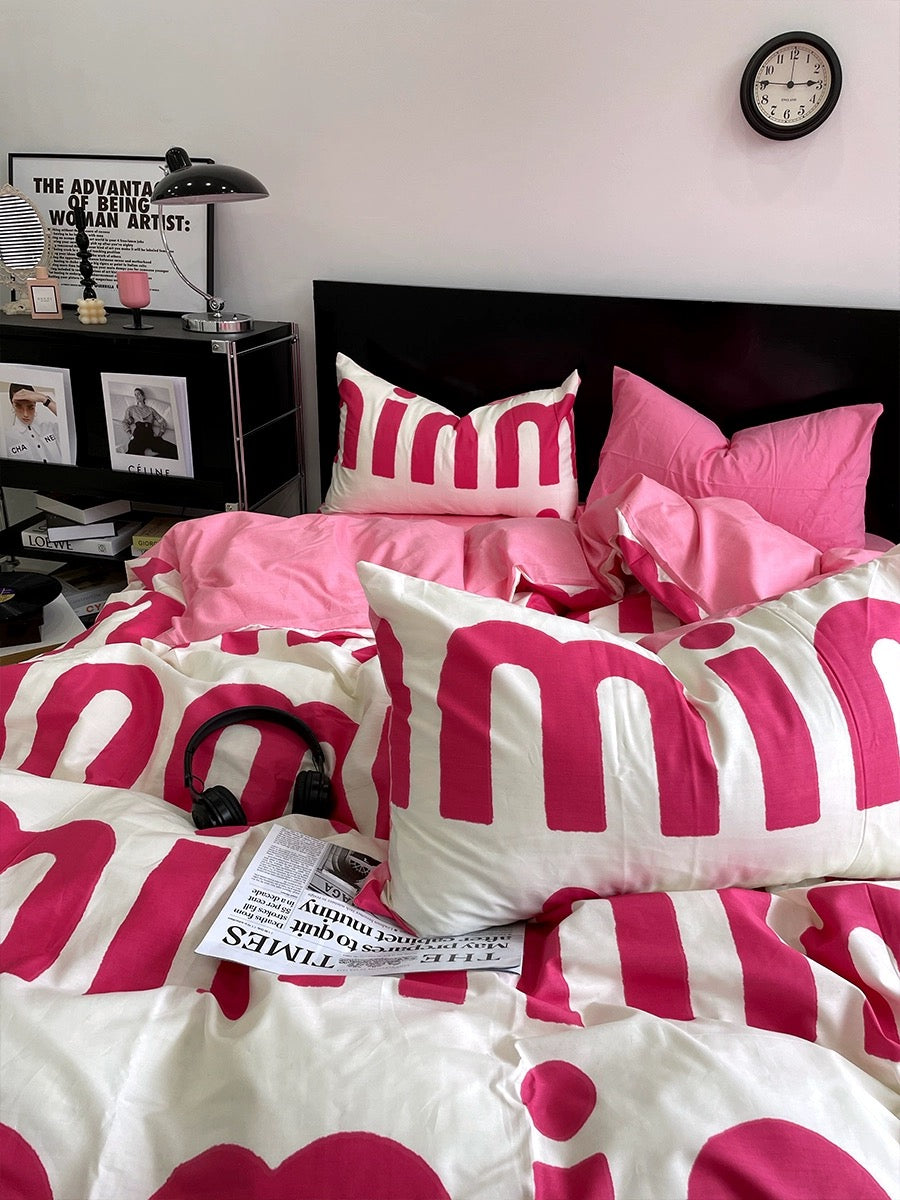 Girly bedroom ideas – pink letter bedding on white background