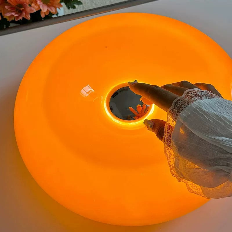 Orange Bauhaus LED lamp with touch-control functionality