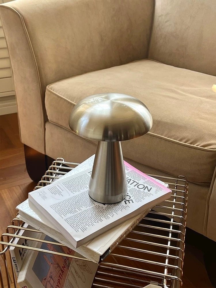 Soft warm light from cordless mushroom lamp on dresser