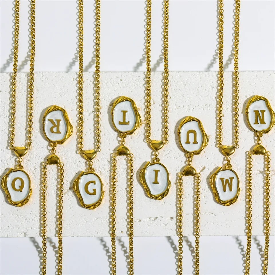 Elegant gold initial necklace with enamel oval pendant