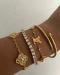 Gold Luxury Bracelets Set displayed elegantly on a jewelry stand