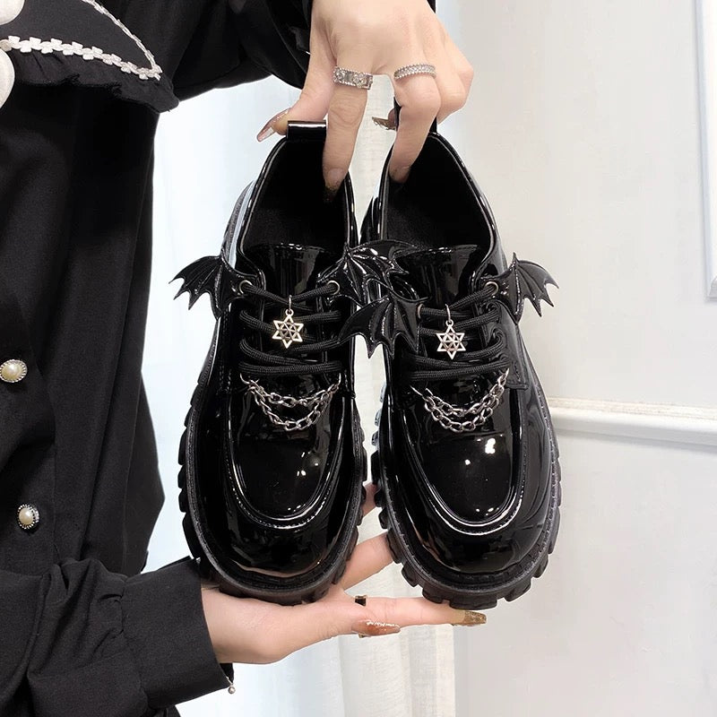 Gothic bat shoes with chunky black platforms, bat wing accents, and metal chain details for women’s alternative fashion