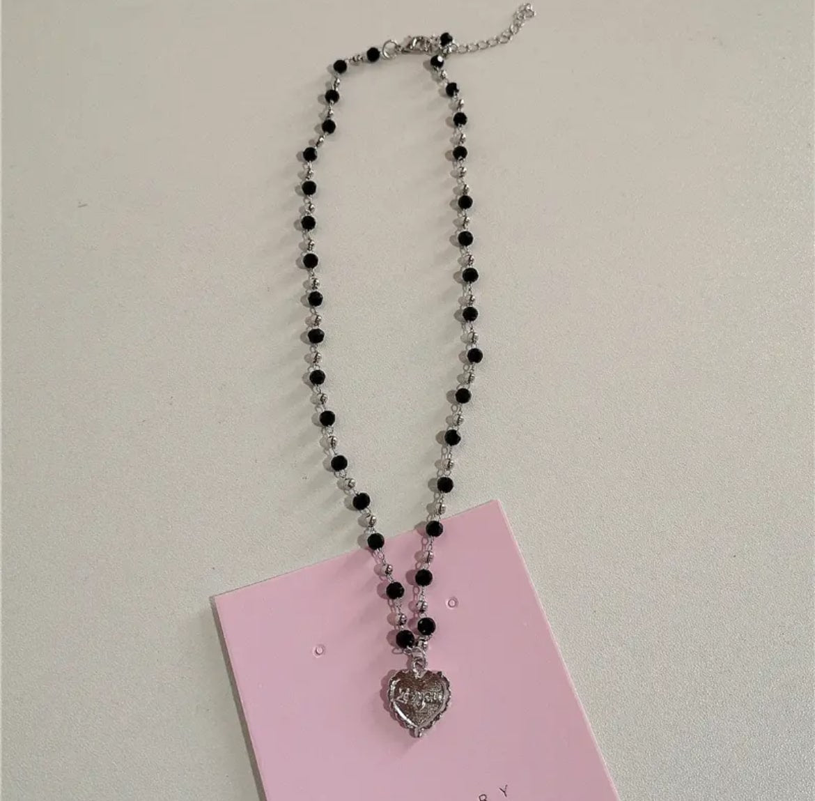 Vintage Y2K emo jewelry, pink beaded necklace with butterfly and heart pendants for Harajuku style and soft girl aesthetic fashion.
