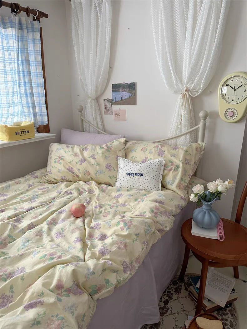 Delicate floral cotton bedding complementing neutral furniture lace curtains wooden accents and cozy layered textiles beautifully
