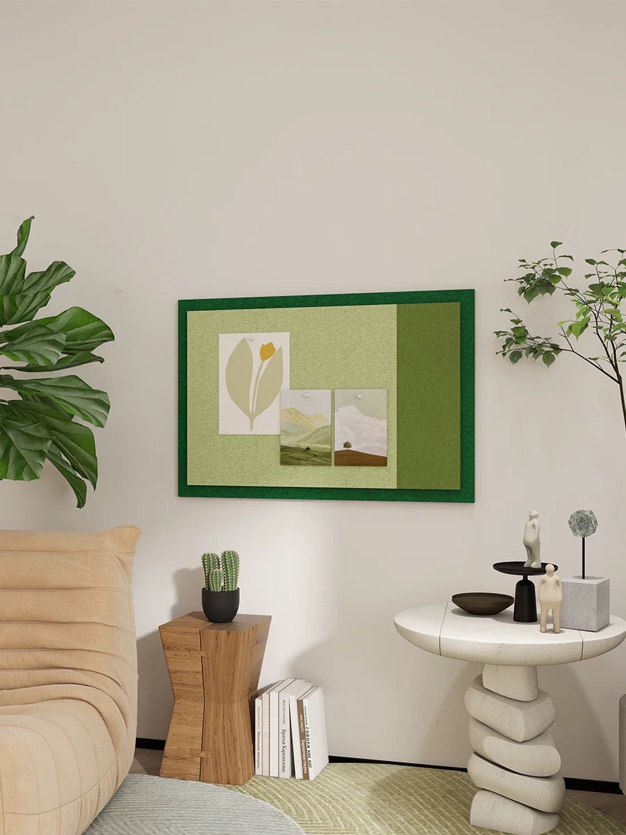 Green Bauhaus photo display board styled on a neutral interior wall