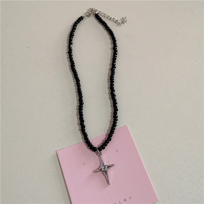 Emo and Harajuku-inspired Y2K choker necklace with pink beaded chain and cute gothic pendants like bow and heart designs.