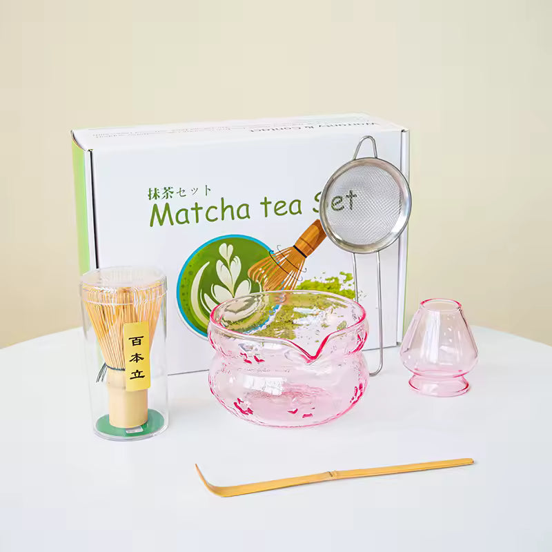 Matcha tea set with tools and a box labeled 'Matcha tea set' on a white surface.