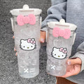 Hello Kitty beverage bottle with straw and pink Sanrio design