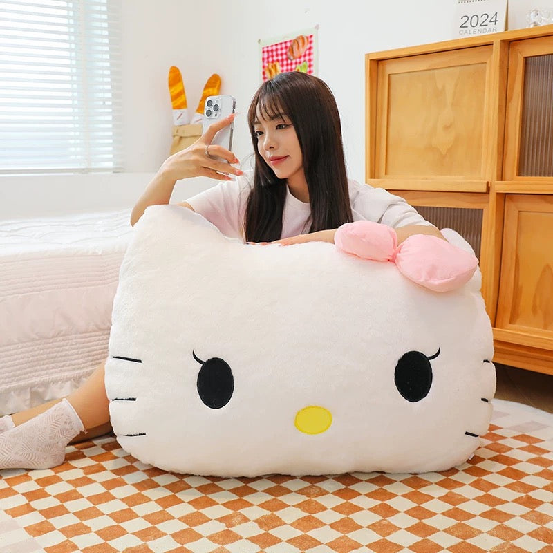 Cozy Hello Kitty plush pillow enhancing bedroom decor with its cute, cartoon style and ultra-soft texture